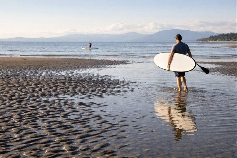 surfing at beach with professional paddleboarders 