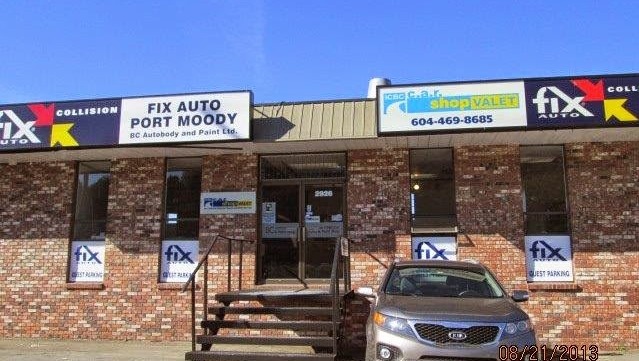 Fix Auto Port Moody collision repair shop storefront with brick facade and vehicle parked outside