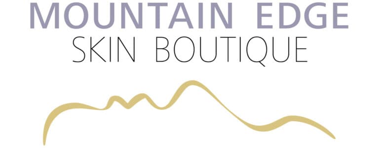Mountain Edge Skin Boutique logo featuring minimalist mountain silhouette design in gold