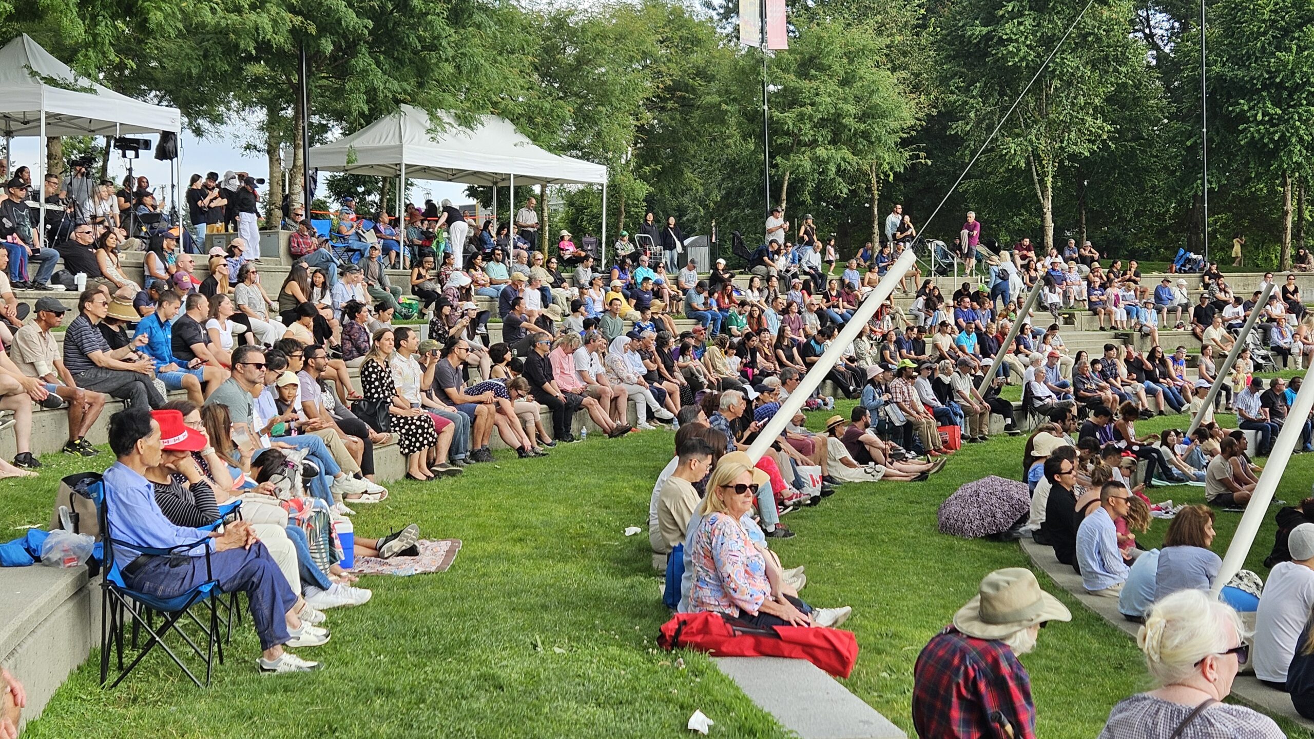 Attendees seated on the lawn at a past Celebrate BC event, Photography Credit Amanda Sezto
