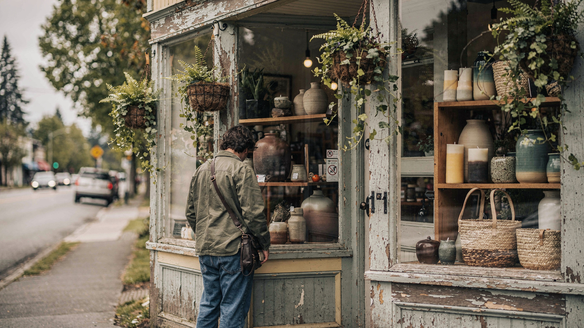 A shopper browsing the window display of an independent gift shop in Port Moody
